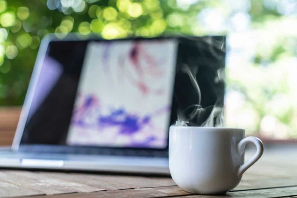 Working with laptop on a balcony