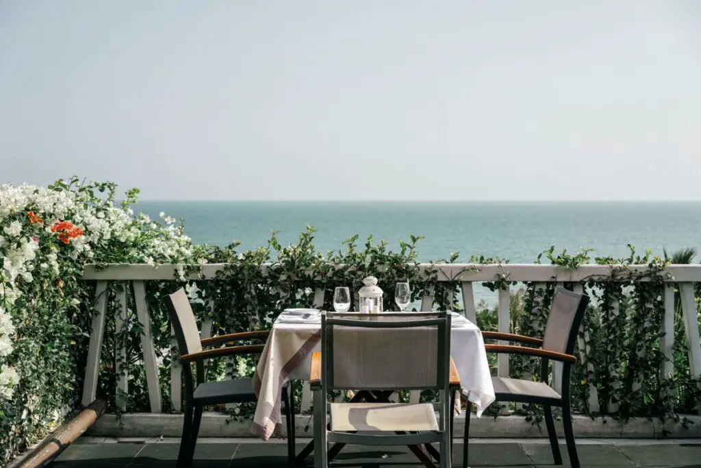 beautiful flowers and ocean view from a balcony