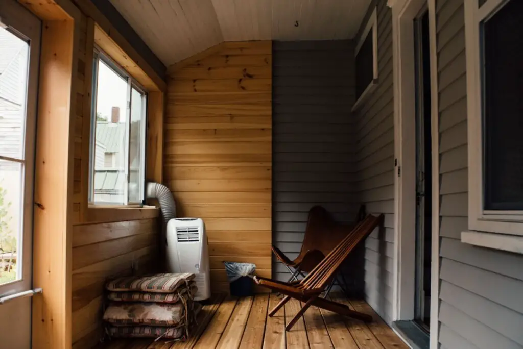 small enclosed veranda that extends the house